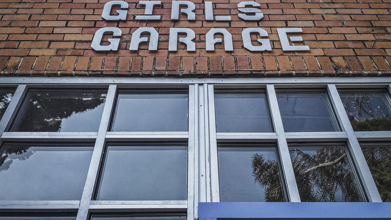Girls Garage signage on the exterior of their workshop
